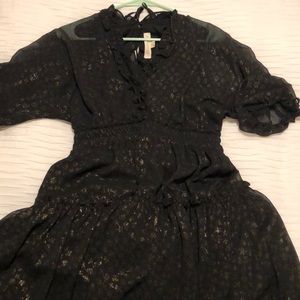 Black and gold polka dotted dress